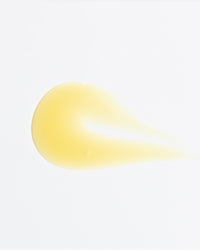 Close-up of Vitamin C-FK Brightening Complex serum drop in gallery position 1 showing smooth texture and pale yellow hue